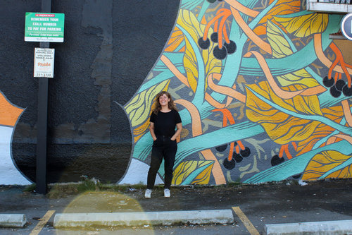 Jill Stanton in front of her art work